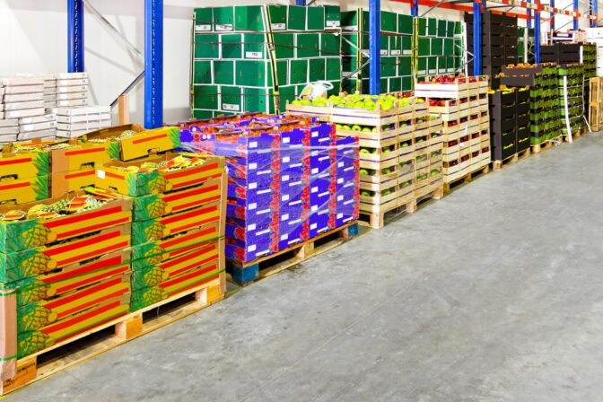 Bunch of fruits and vegetables in crates at warehouse